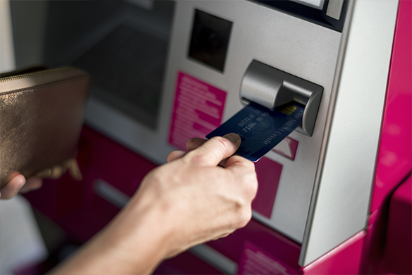 Person using an ATM at a bank