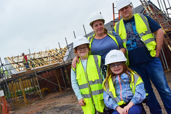 Helen and family with adaptive bungalow