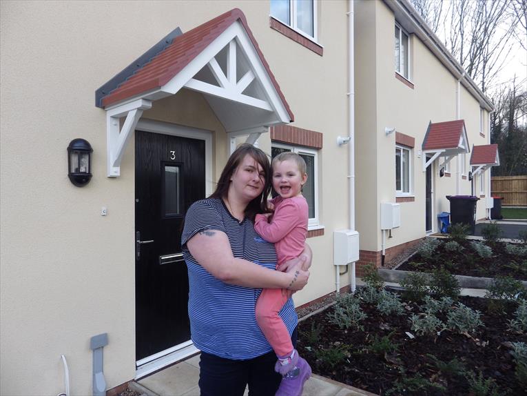 Jordan Westwood with her three-year-old daughter Letty-Mai outside their new home